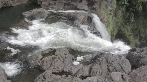 Top of a high tropical waterfall looking down Stock Footage 94309565