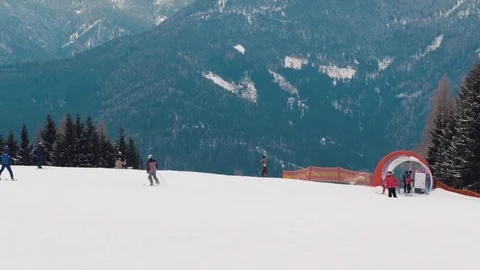 Top of the hill of austrian ski resort with skiers Video stock 73647617
