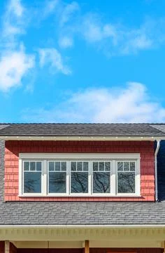 The top of the house with nice window. Stock Photos