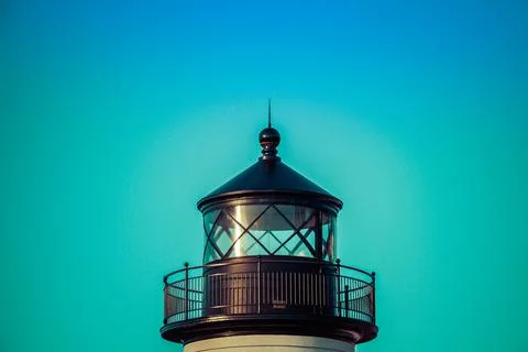 The top of a lighthouse in daylight against a cloudless sky Stock Photos