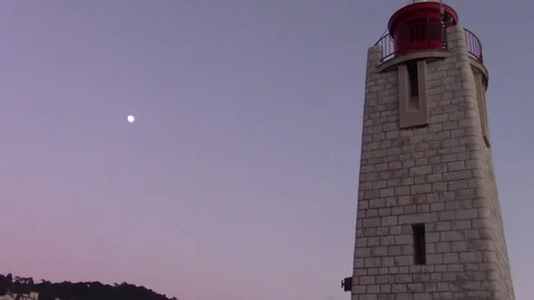 Top of a lighthouse with the moon in the sky Stock Footage 71280609