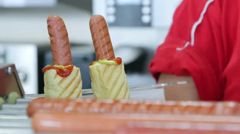Top loading hot dogs and commercial hotdog roller grill cooker Stock Footage 41555994