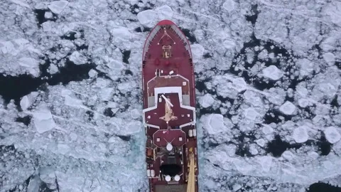 Top Lockdown Shot Of Nautical Vessel Moving On Frozen Ice Over Lake During Stock Footage 233999396