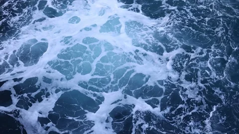 Top looking down of surf waves rolling over a reef with white water break. Stock-Footage 197354350
