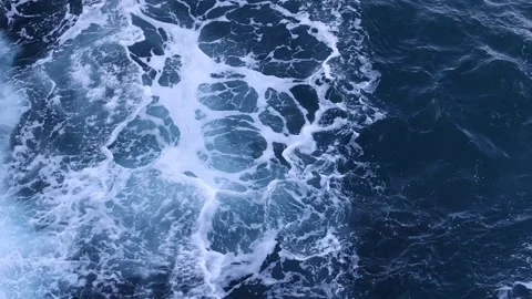 Top looking down of surf waves rolling over a reef with white water break. Stock Footage 199395001
