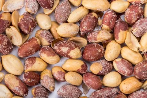 Top macro view of roasted pile of peanuts Stock Photos