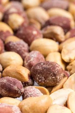 Top macro view of roasted pile of peanuts Stock Photos