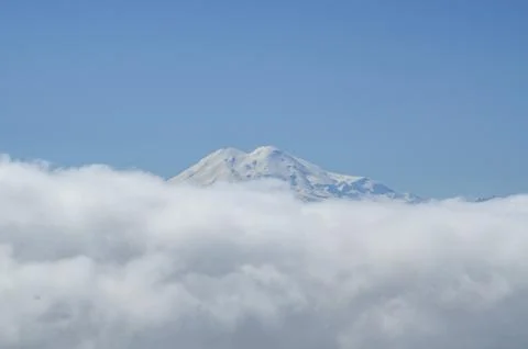 The top of the mountain against the background of clouds. Stock Photos