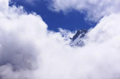 The top of the mountain in the clouds Stock Photos
