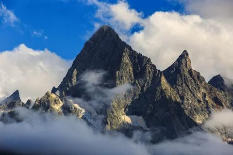 Top of the mountain with glacier, in the clouds. View of the Caucasus Range,  Stock Photos