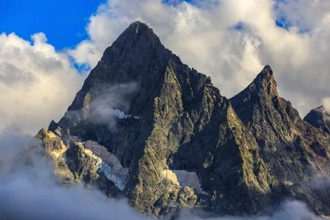 Top of the mountain with glacier, in the clouds. View of the Caucasus Range,  Stock Photos
