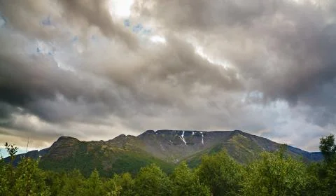 Top mountain Khibiny in the form of a background of the cloudy sky. Stock Photos
