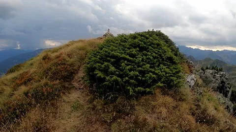 At the top of the mountain peak. Video stock 145857975