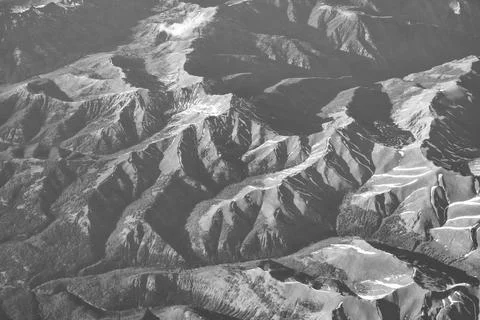 Top of mountain from plane. Landscape with mountain in cloudy nature. Cloud and Stock Photos