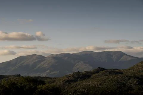 Top a mountain range showing in the background Stock-Fotos