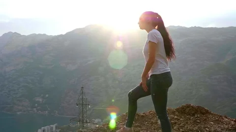 At the top of the mountain in the rays of the sun. Stock Footage 90790490