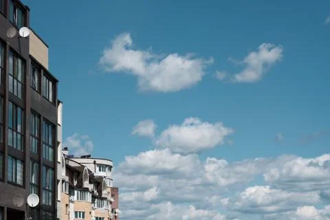 The top of a multi-storey building, a view of the roof and the sky. Brick house Stock Photos
