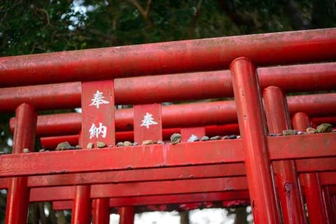 Top of multiple red torii gates with pebbles Stock Photos