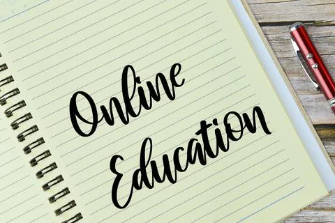 Top of notebook written with text ONLINE EDUCATION Stock Photos