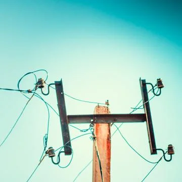 Top old electrical pillar on a background of the blue sky Stock-Fotos