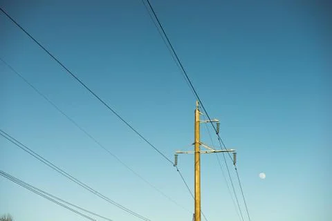 Top old electrical pillar on a background of the blue sky Stock Photos