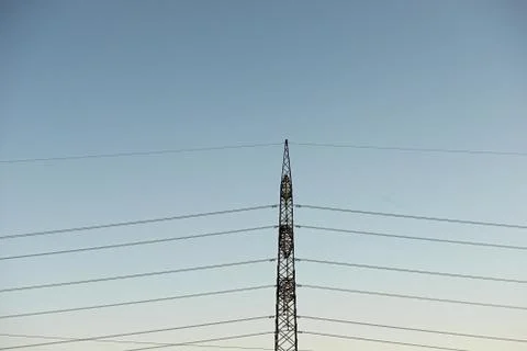 Top old electrical pillar on a background of the blue sky Stock Photos