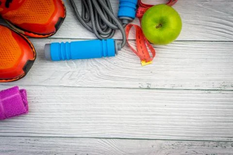 Top or flat lay view of healthy and gym, excercise kits on wooden background 库存照片