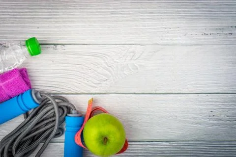 Top or flat lay view of healthy and gym, excercise kits on wooden background 库存照片