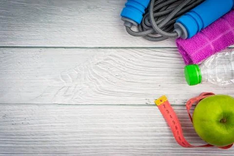 Top or flat lay view of healthy and gym, excercise kits on wooden background 库存照片
