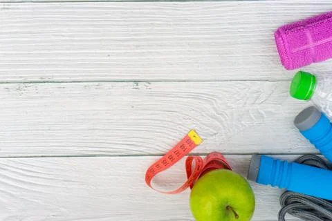 Top or flat lay view of healthy and gym, excercise kits on wooden background 库存照片