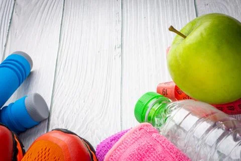 Top or flat lay view of healthy and gym, excercise kits on wooden background Stock Photos