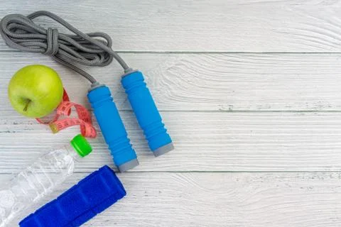 Top or flat lay view of apple fruit and skipping rope with copy space area on 스톡 사진