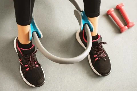 Top or flat view of a young girl with running shoe and dumbbells Stock Photos