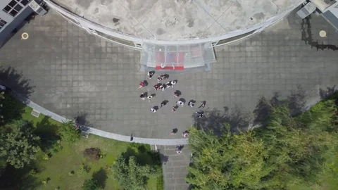 Top overhead shot while people come outside from the building Stock Footage 115923226