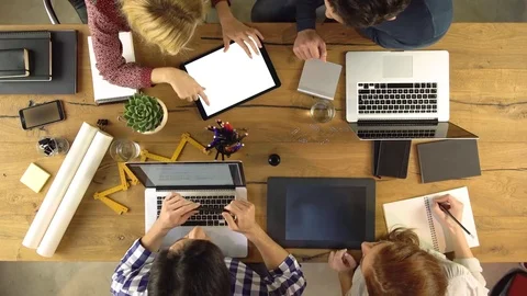 Top overhead view people group using tablet on a design project idea. Creative 動画素材 75310945