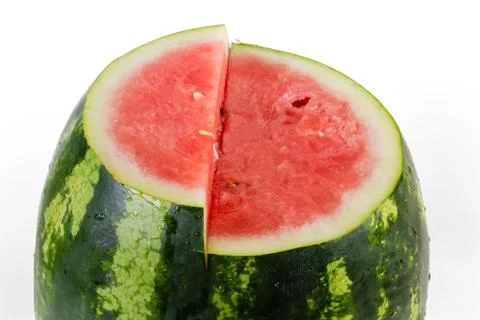 Top part of partly cut striped watermelon close-up Stock Photos