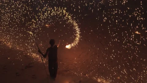 Top Perspective of a Fire Performer Creating a Massive Circular Ring of Sparks Stock Footage 334296793