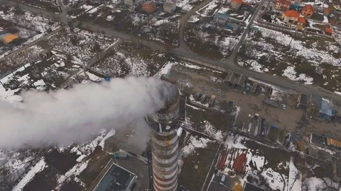 Top of the pipe with steam during the winter heating season (aerial shot). 4K Stock Footage 72134480