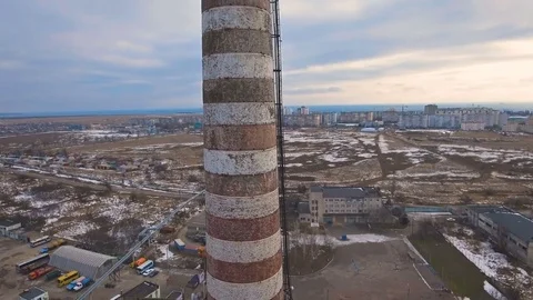 Top of the pipe with steam during the winter heating season (aerial shot). 4K Stock Footage 72134882