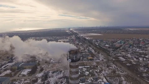 Top of the pipe with steam during the winter heating season (aerial shot). 4K Stock Footage 72135261
