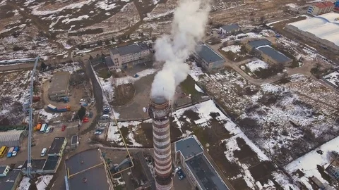 Top of the pipe with steam during the winter heating season (aerial shot). 4K Stock Footage 72135656