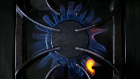 Top point view of a gas burner heating up in the dark Stock Footage 301666832