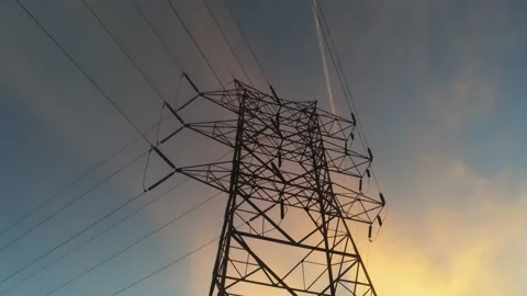 Top of power tower in sunset - Drone camera moves left around top of tower Video stock 141418930