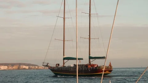 Top sail schooner without sheet moving in sea during sunset Stock Footage 104290517