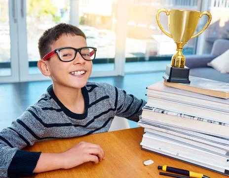 Top scholar and top lad. Portrait of a smart young boy posing next to his Stock Photos