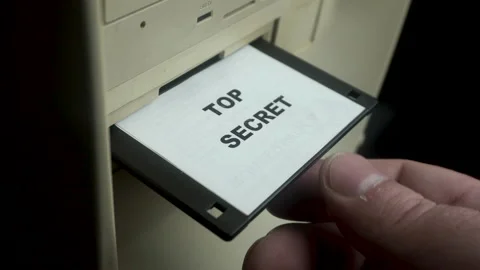 Top Secret Classified Documents on Floppy Disk, Placing Into PC Computer Stock Footage 180405341