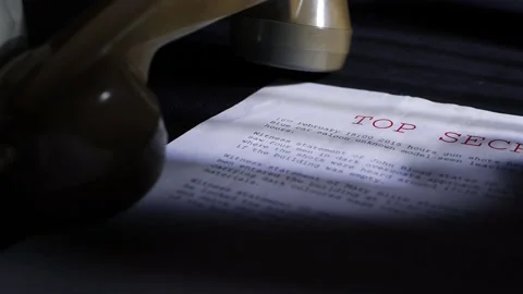 Top secret document in dark room with vintage phone Stock Footage 171540102