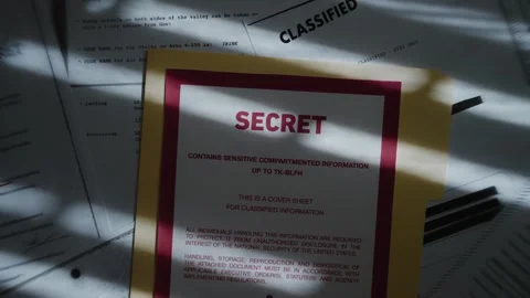 Top secret manila folder with various classified censored documents and files Stock Footage 316317634