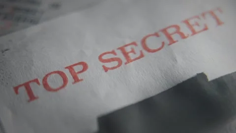 Top Secret red rubber stamp on government classified paper document retro old Stock Footage 334963389