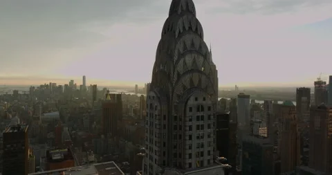 Top section of Chrysler Building with crown decoration against setting sun Stock Footage 167732659